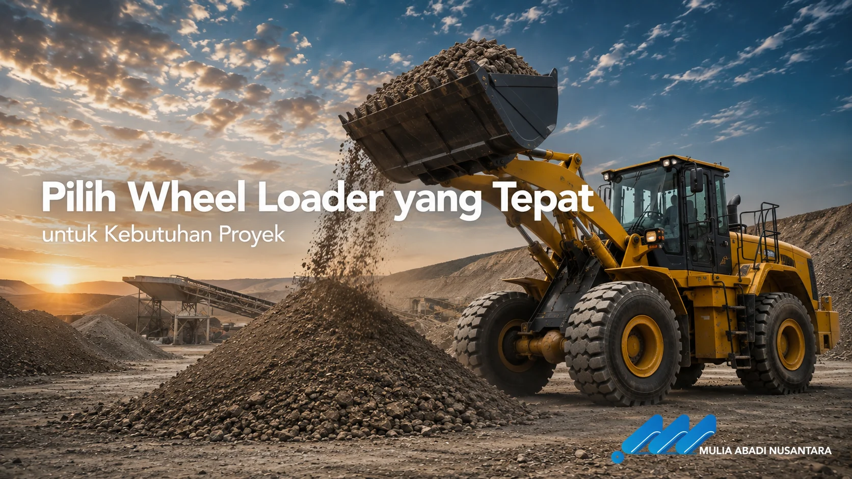 Banner Pilih Wheel Loader yang Tepat untuk Kebutuhan Proyek dengan wheel loader memindahkan material batu di area proyek.