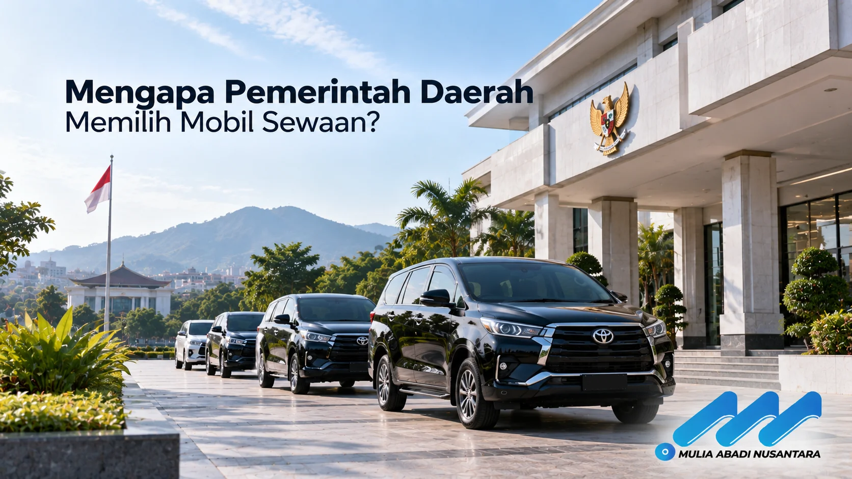 Banner mobil operasional di depan gedung pemerintahan dengan judul “Mengapa Pemerintah Daerah Memilih Mobil Sewaan?” dan logo Mulia Abadi Nusantara.